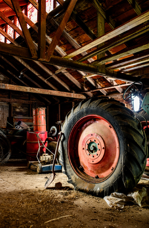 Archival photograph of the family tractor at rest in the field