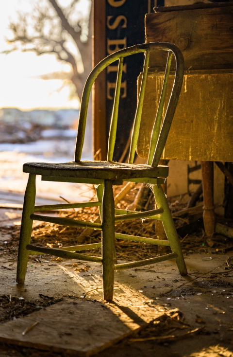old weathered chair in barn